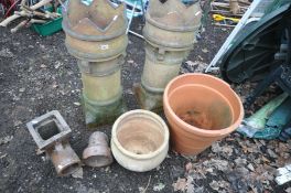 A PAIR CLAY CHIMNEY POTS, diameter 34cm x height 81cm, a terracotta circular planter (some damage to