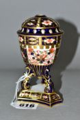 A ROYAL CROWN DERBY TRIPOD BASE POT POURRI VASE WITH COVER, decorated in the Imari pattern,