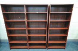 A SET OF SIX MATCHING MAHOGANY OPEN BOOKCASES, with five shelves, width 76cm x depth 29cm x height