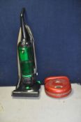 AN ELECTROLUX TRILOBITE REMOTE VACUUM CLEANER with charger and an Electrolux enviro vac upright