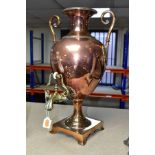 A COPPER AND BRASS SAMOVAR IN THE FORM OF A CLASSICAL URN, the neck forming the lid, with