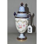 A ROYAL CROWN DERBY TWIN HANDLED URN WITH COVER, the body is decorated with two panes of hand