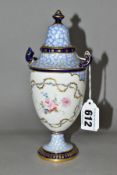 A ROYAL CROWN DERBY TWIN HANDLED URN WITH COVER, the body is decorated with two panes of hand