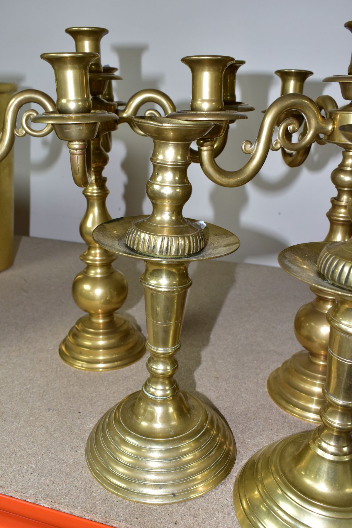 A PAIR OF MODERN BRASS FIVE BRANCH CANDELABRA AND A MATCHED PAIR OF BRASS CANDLESTICKS, the - Image 3 of 6