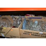 FOUR BOXES OF ASSORTED GLASSWARE, including plain drinking glasses, vases, decanters, jugs,