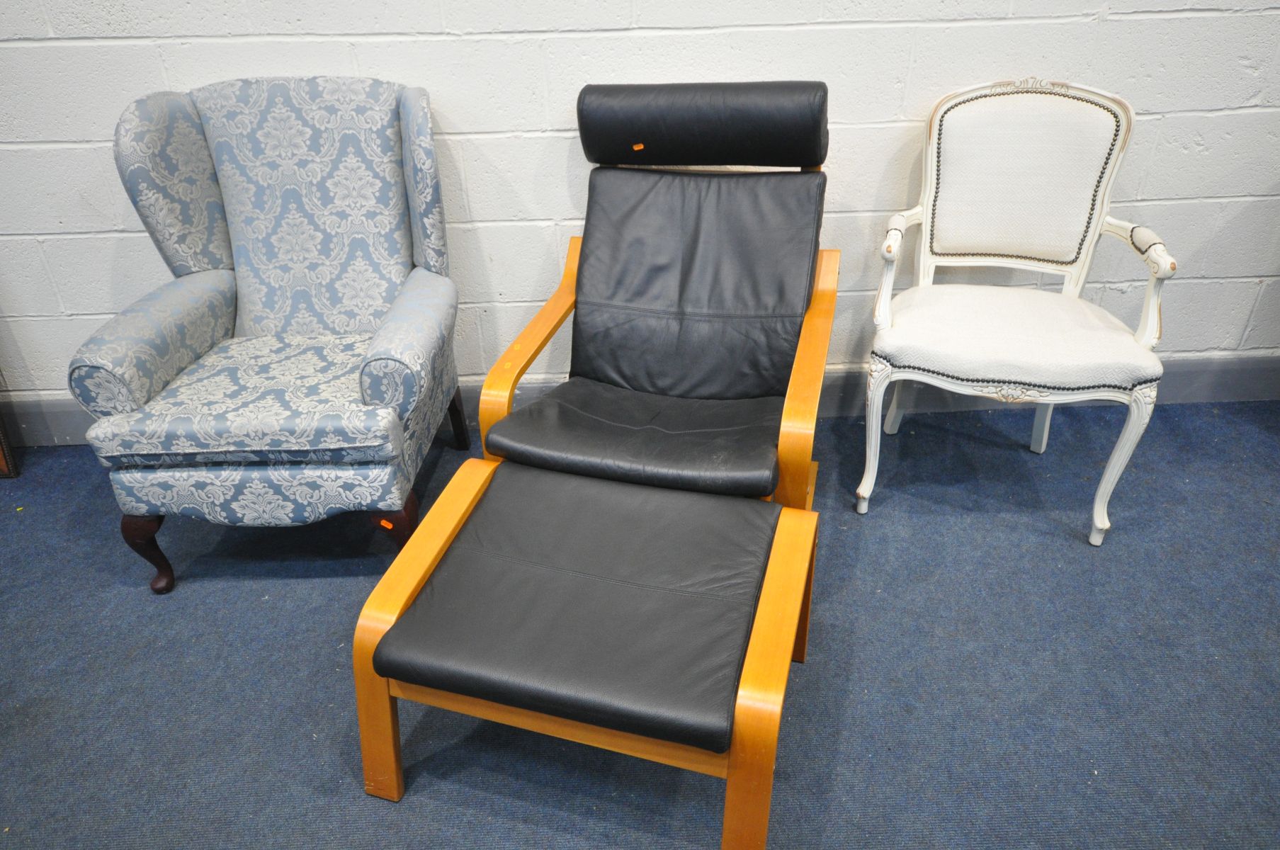 A MODERN BEECH AND BLACK LEATHERETTE CANTILEVER CHAIR, and footstool, along with a French armchair