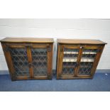 A PAIR OAK TWO DOOR LEAD GLAZED BOOKCASES with three shelves, width 107cm x depth 31cm x height