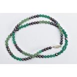 A GEM BEAD NECKLACE, the single row of near uniform mainly spherical beads comprising dyed green