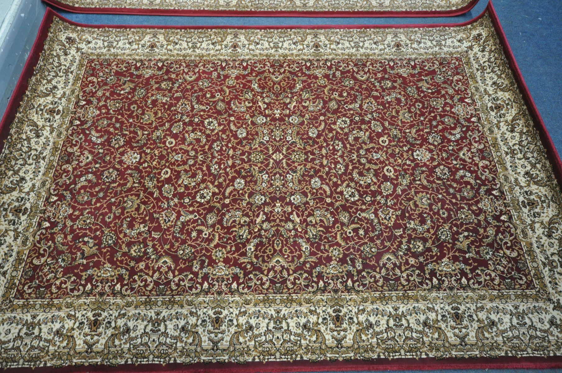 TWO LATE 20TH CENTURY RED AND CREAM ORIENTAL RUGS, made by Dunelm, 230cm x 160cm - Image 2 of 5