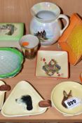 A GROUP OF NOVELTY CARLTON WARE ASHTRAYS, TRINKETS ETC, comprising three 1930s Dogs Head ashtrays,