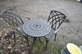 A MODERN METAL CIRCULAR GARDEN TABLE, diameter 60cm x height 75cm, and two armchairs (3)