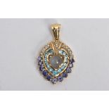 A 9CT GOLD GEM SET PENDANT, of a tear drop form, centring on a moonstone cabochon, within a surround