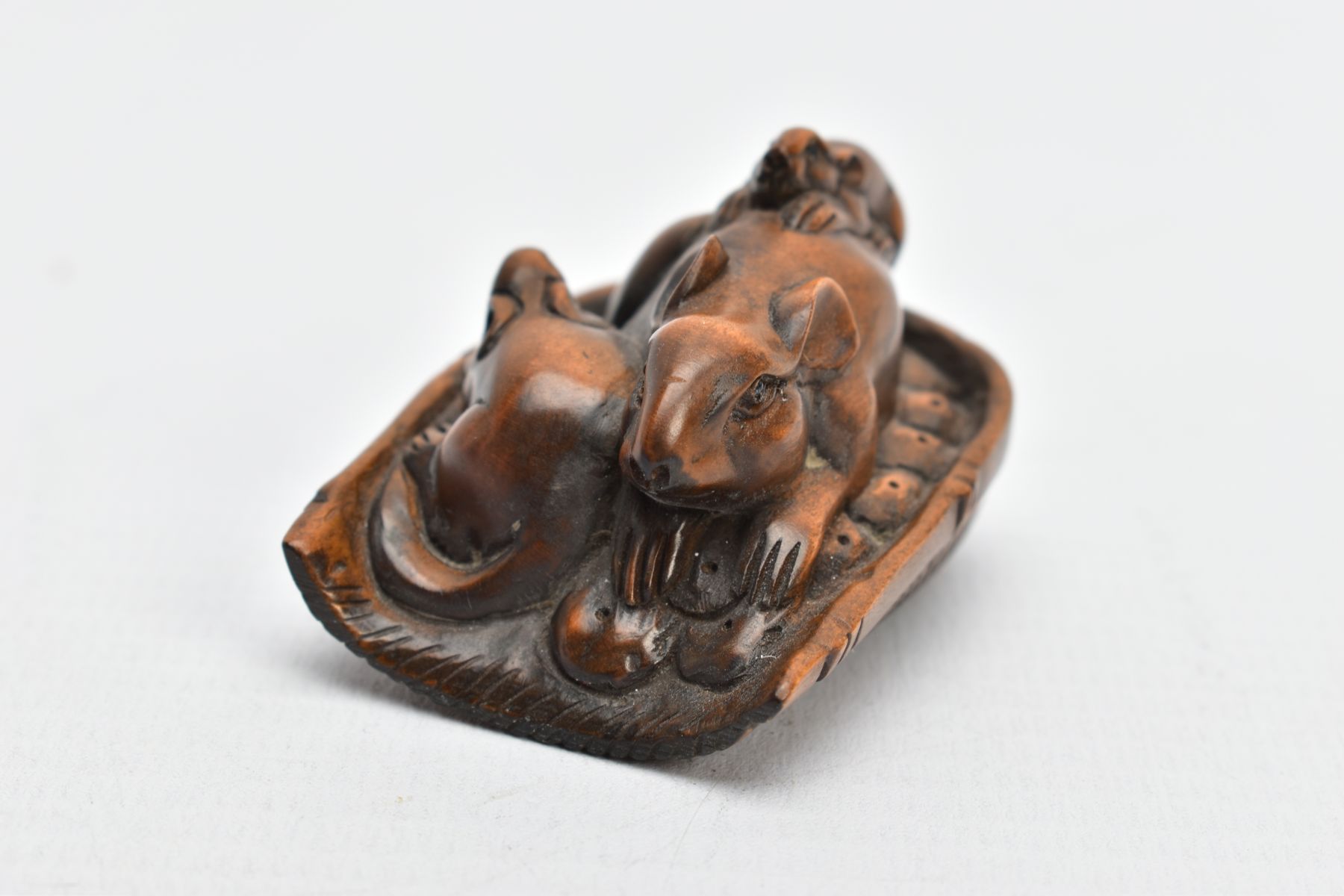 A CHINESE WOODEN NETSUKE, a small carved wooden netsuke depicting three mice in a basket, signed - Image 2 of 7