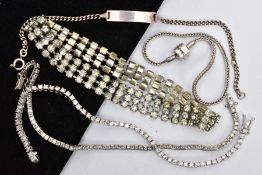 AN ASSORTMENT OF WHITE METAL BRACELETS, to include two tennis bracelets one set with circular cut