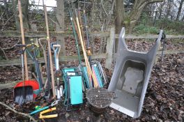 A QUANTITY OF GARDEN TOOLS, to include a plastic wheelbarrow, spades, shoves, three folding kneeler,