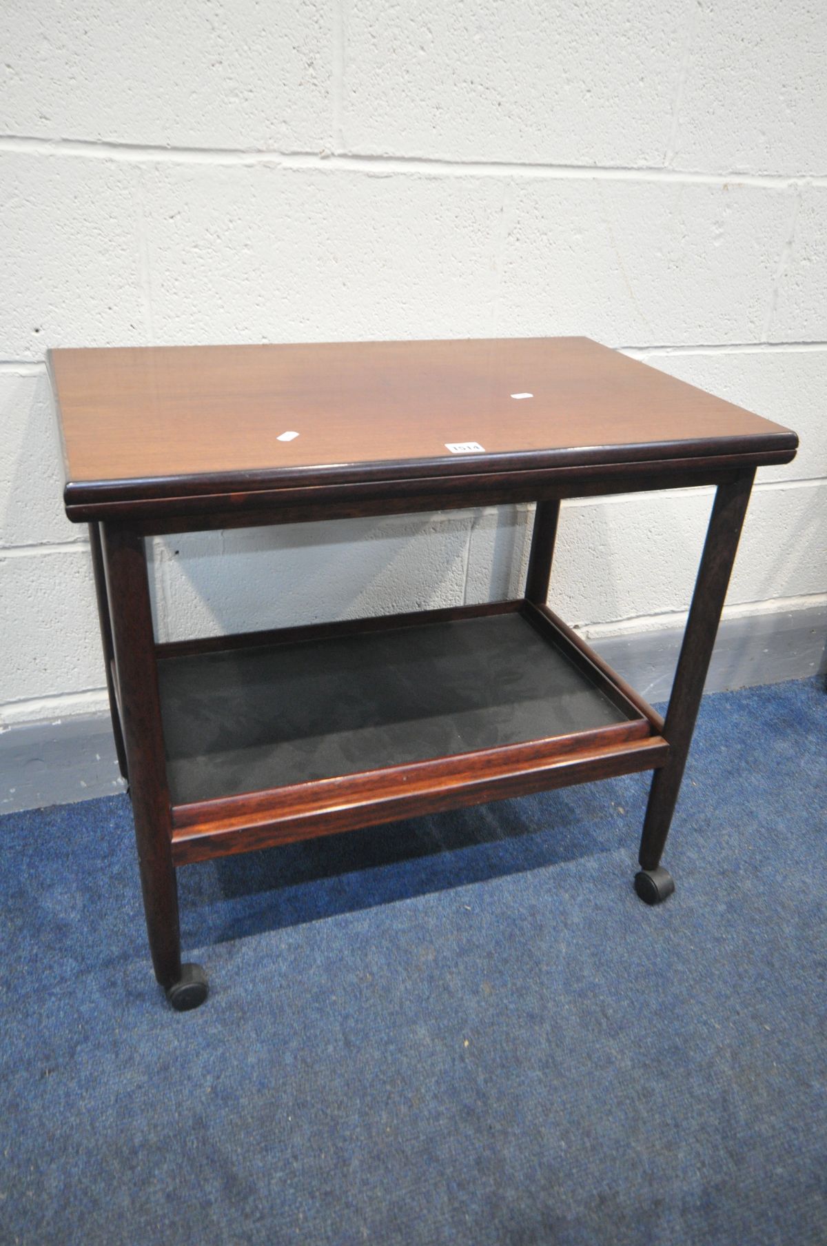 POUL JEPPESENS MOBELFABRIK FOR GRETE JALK, a rosewood finish tea trolley, with a fold over top and