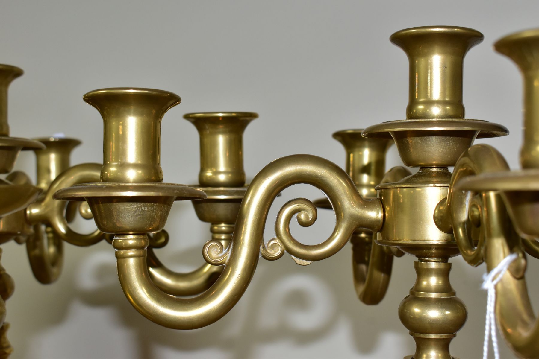 A PAIR OF MODERN BRASS FIVE BRANCH CANDELABRA AND A MATCHED PAIR OF BRASS CANDLESTICKS, the - Image 6 of 6