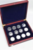 A CASED SET OF 24 .999 SILVER CROWN SIZE PROOF COINS IN CAPSULES, from most of the commonwealth