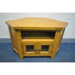 A LIGHT OAK CORNER TV STAND, width 105cm x depth 55cm x height 56cm (condition:- small paint