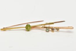 TWO EARLY 20TH CENTURY BAR BROOCHES, one tapered bar brooch set with a single oval cut peridot,