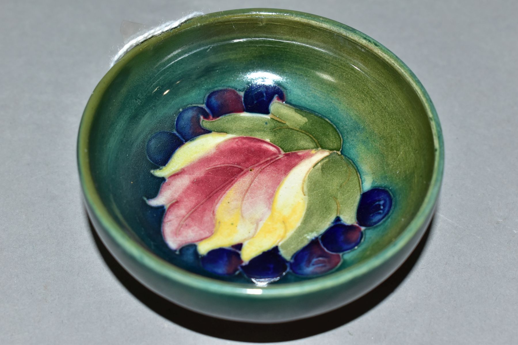 A MOORCROFT LEAF AND BERRY PATTERN FOOTED BOWL, impressed marks to the base, approximate diameter - Image 2 of 4