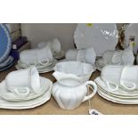 A SHELLEY PLAIN WHITE DAINTY SHAPE TEA SET, comprising a pair of shaped square bread and butter