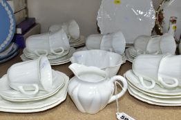 A SHELLEY PLAIN WHITE DAINTY SHAPE TEA SET, comprising a pair of shaped square bread and butter