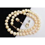 A CULTURED PEARL NECKLACE AND A PAIR OF EARRINGS, the graduated pearl necklace of baroque and