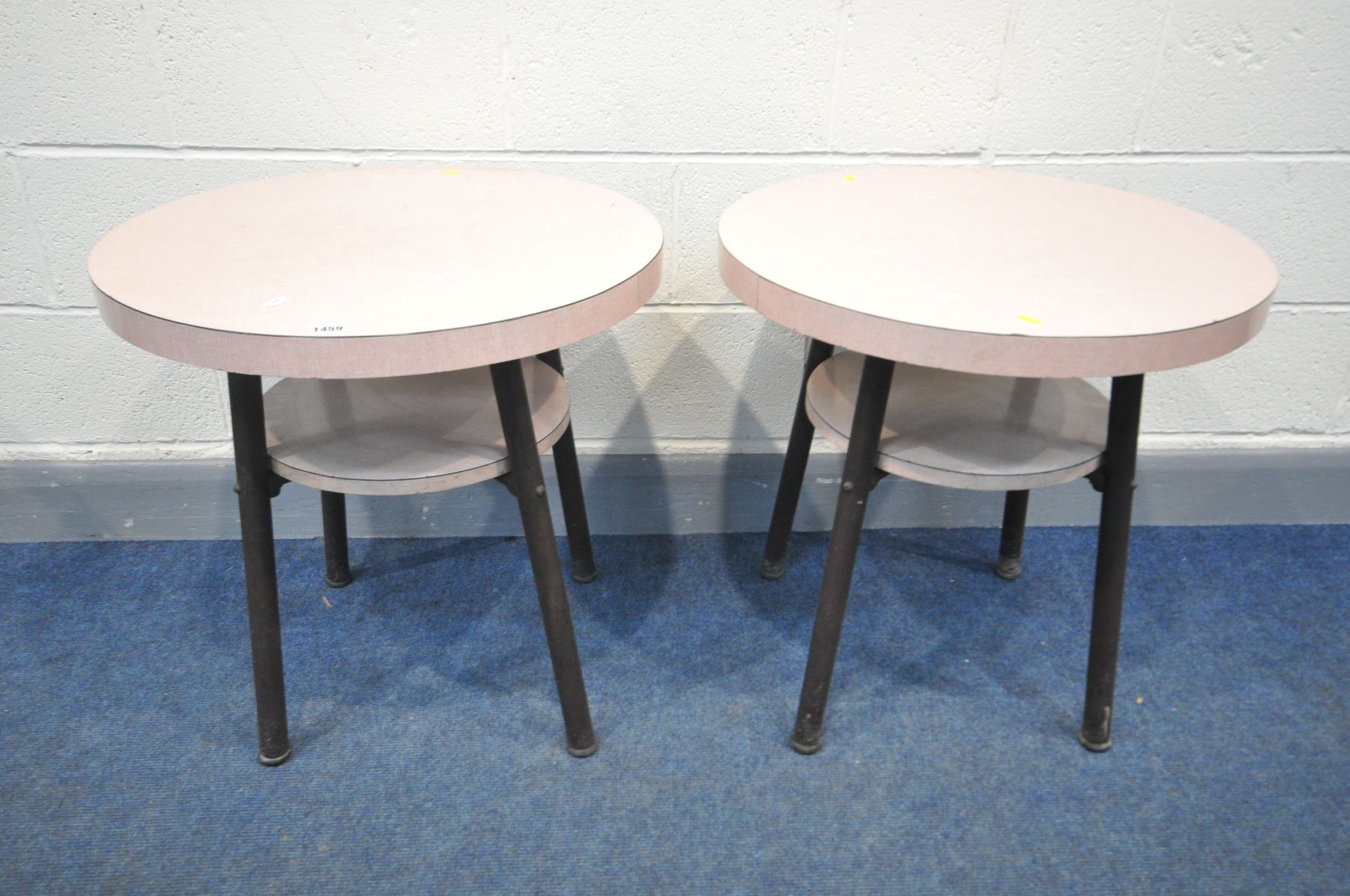 A PAIR OF 1950'S PINK FORMICA PUB TALBE ON TUBULAR LEGS, diameter 61cm x height 60cm