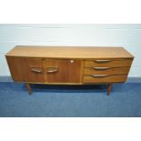 A MID CENTURY BEAUTILITY TEAK SIDEBOARD, with double cupboard doors, besides three drawers,