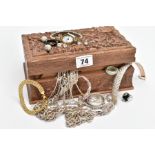 A CARVED WOODEN BOX WITH CONTENTS, to include a silver articulated bracelet fitted with a lobster