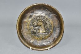 A MODERN BRONZE PLATE, after Pisanello/Pisano, the central motif depicting a horse's head, books and