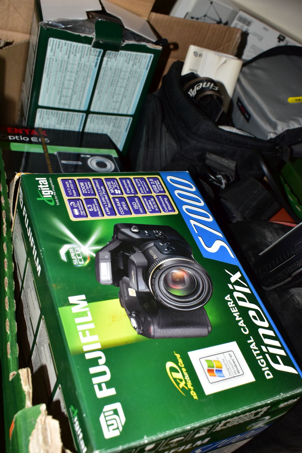 THREE BOXES OF CAMERAS, BINOCULARS, DVDS, CDS, ETC, including a boxed Fujifilm S7000 Finepix digital - Image 7 of 9