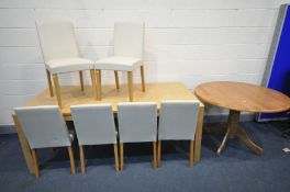 A LIGHT OAK EFFECT EXTENDING DINING TABLE, with a single fold out leaf, extended length 194cm x