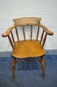 AN EARLY 20TH CENTURY ASH AND BEECH SMOKERS BOW CHAIR