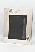 A LARGE SILVER-PLATED PHOTO FRAME, of a rectangular form plain polished design with applied