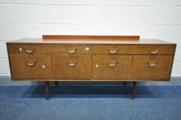 A MID CENTURY MEREDEW TEAK SIDEBOARD, with four drawers above four deep drawers, on cylindrical