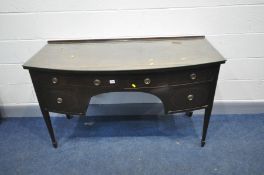 AN EDWARDIAN MAHOGANY BOWFRONT SIDEBOARD with herringbone stringing to door, drawer front and top,