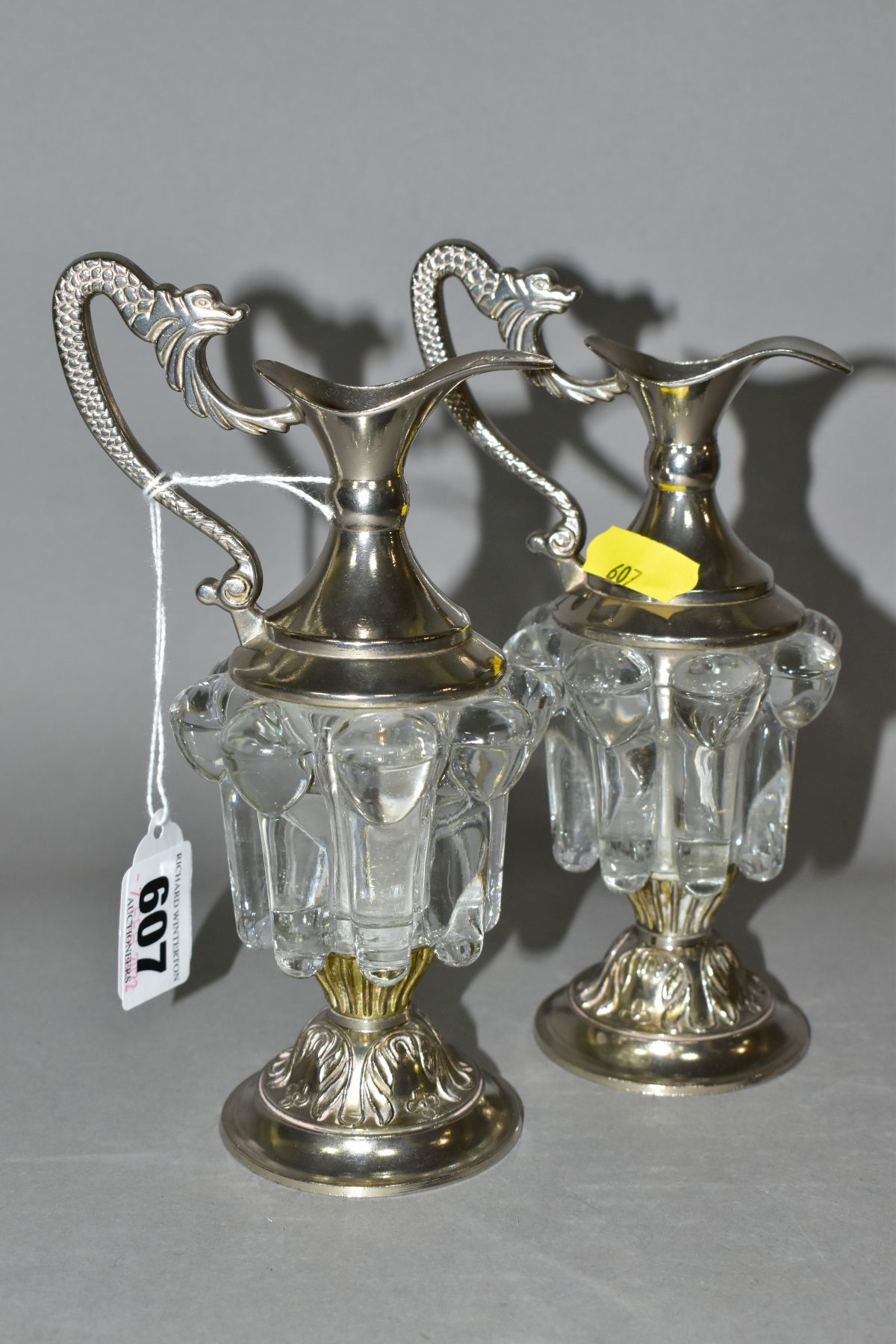 A PAIR OF DECORATIVE GLASS AND EPNS MINIATURE CLARET JUGS, the handles cast as mythical creatures, - Image 3 of 7