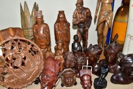 TWENTY ONE WOODEN ETHNIC AND TRIBAL FIGURAL CARVINGS AND FACE MASKS, ETC, to include a Boma Canada