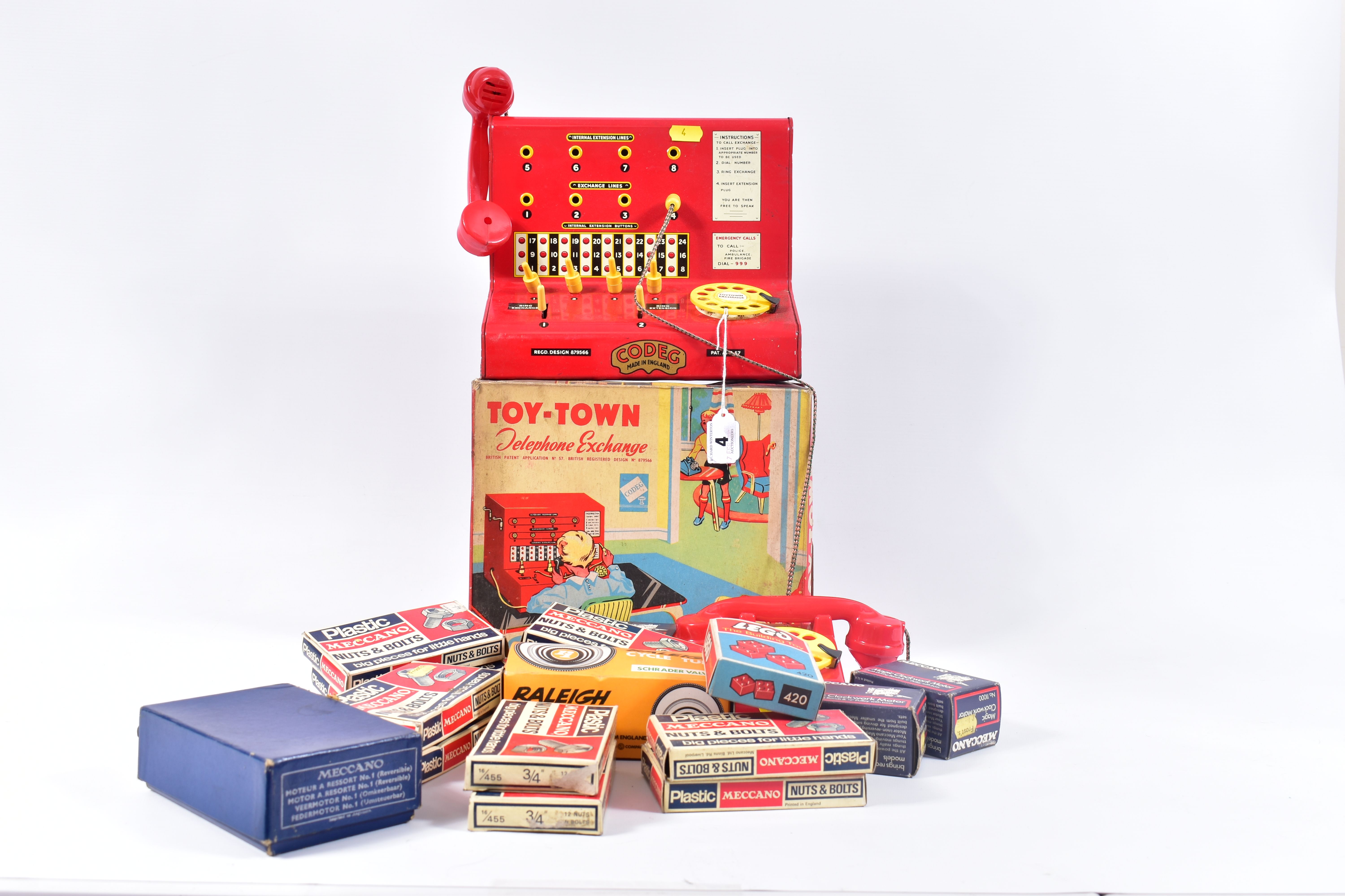 A BOXED CODEG TOY-TOWN TELEPHONE EXCHANGE, of tinplate and plastic construction, exchange unit is