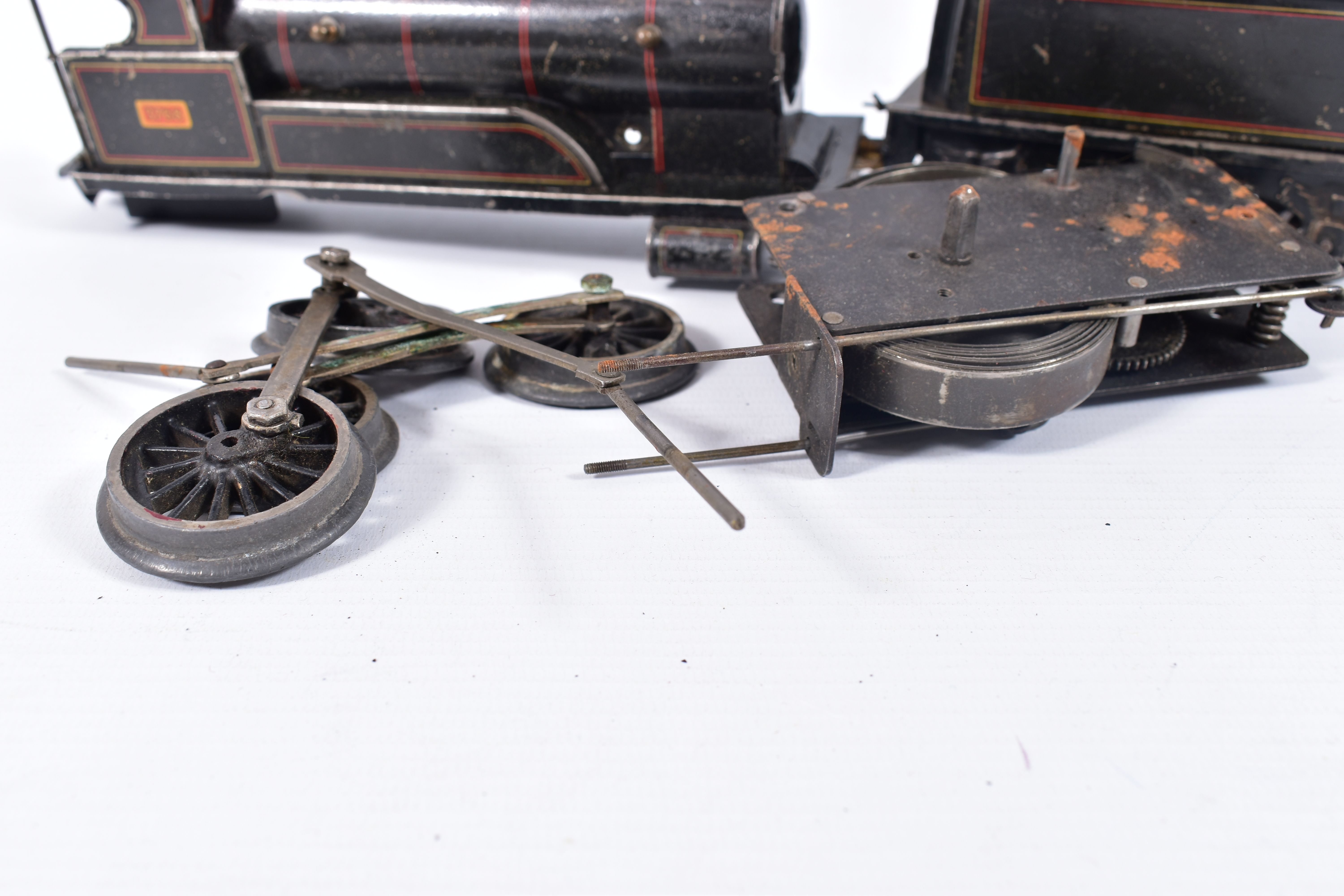A BING CLOCKWORK O GAUGE 0-4-0 LOCOMOTIVE AND TENDER, No.3768, lined black livery, dismantled and in - Image 4 of 4