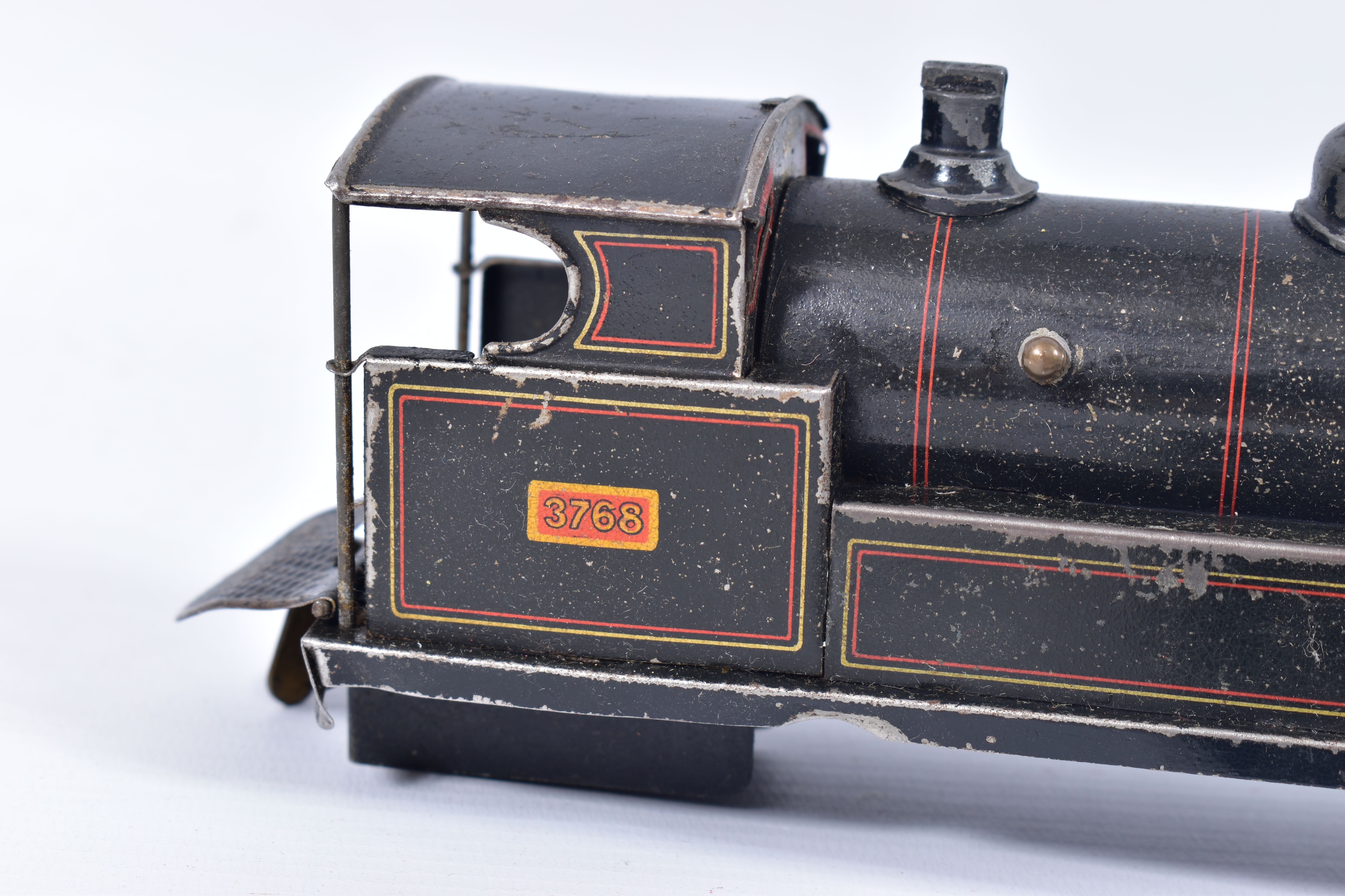 A BING CLOCKWORK O GAUGE 0-4-0 LOCOMOTIVE AND TENDER, No.3768, lined black livery, dismantled and in - Image 2 of 4