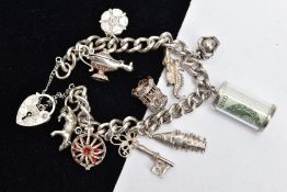 A SILVER CHARM BRACELET AND CHARMS, a curb link bracelet fitted with and engraved heart padlock