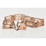 A 9CT ROSE GOLD GATE BRACELET, a four row rose gold gate bracelet (solder marks to some of the links