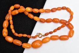 A NATURAL AMBER BEAD NECKLACE, graduated oval beads, largest measuring approximately 20.7mm x 15.