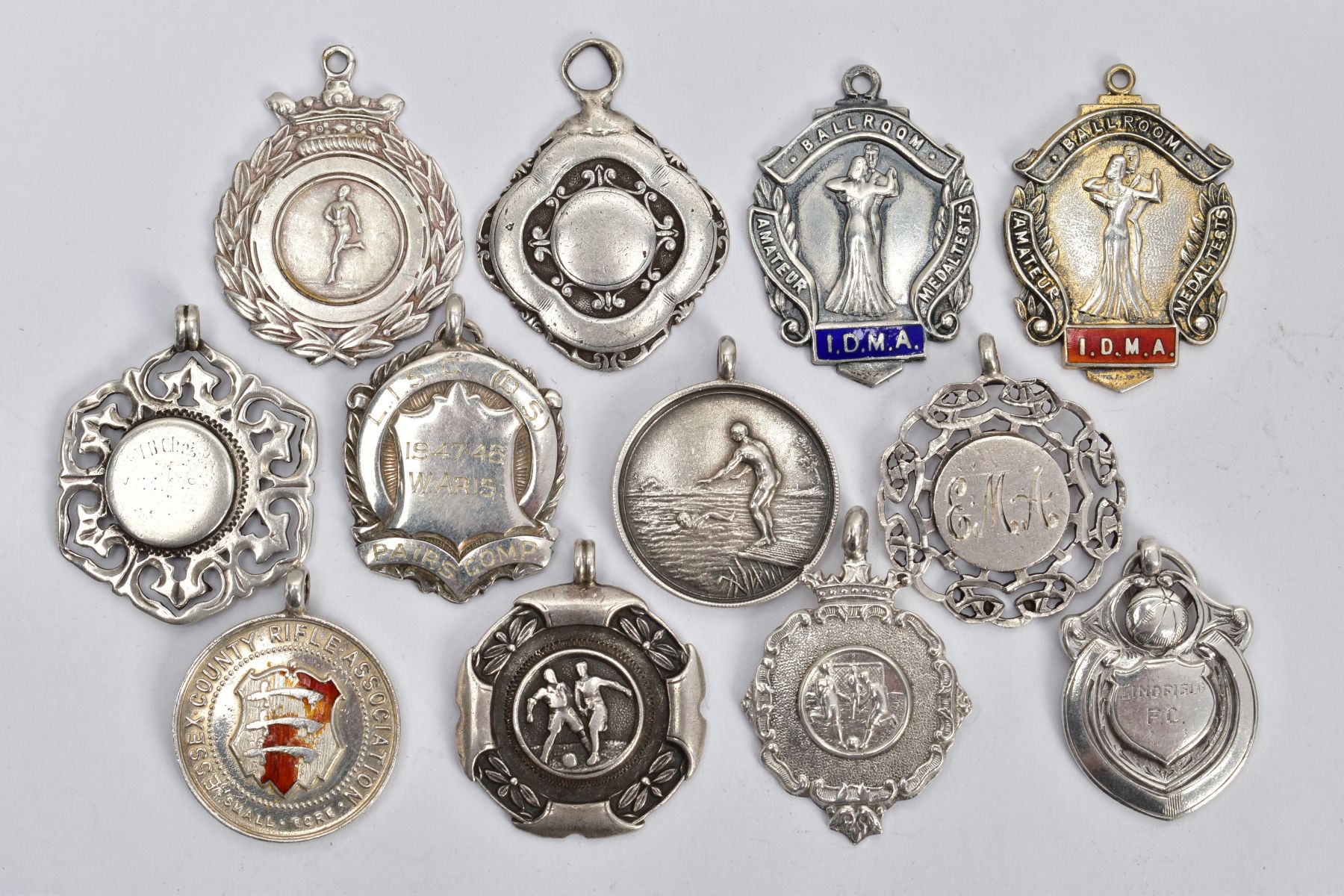 AN ASSORTMENT OF SILVER AND WHITE METAL MEDALS AND PENDANTS, to include two silver ballroom