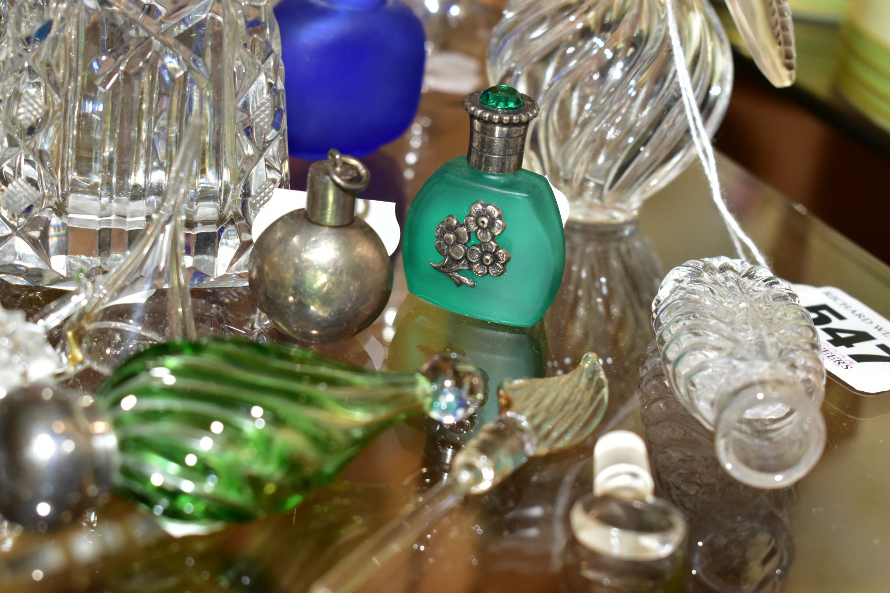 A COLLECTION OF 19TH AND 20TH CENTURY PERFUME BOTTLES , SPARE STOPPERS AND A FUNNEL, mostly glass, - Image 9 of 16