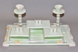 AN ART DECO PINK, GREEN AND CLEAR PLASTIC DRESSING TABLE SET, comprising rectangular tray, a pair of