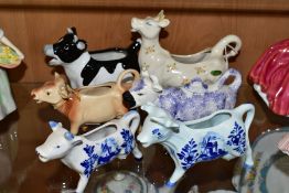 A BESWICK DAISY THE COW CREAMER AND FIVE OTHER LATE 20TH CENTURY COW CREAMERS, the Beswick example